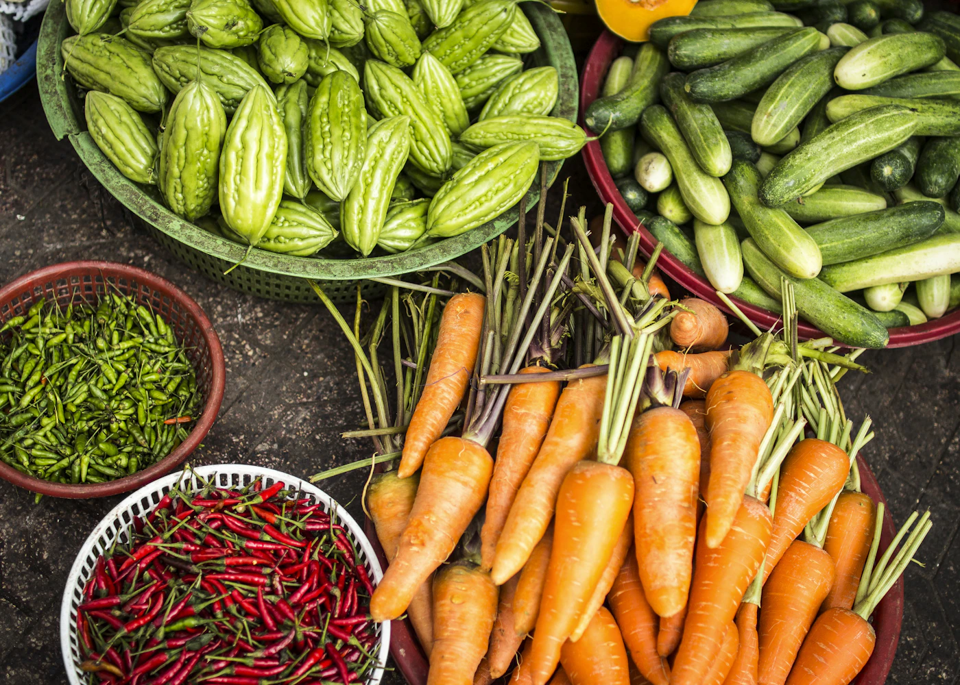 Fresh vegetables in market baskets